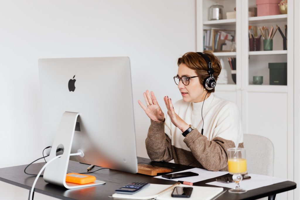 Person in home office wearing headphones